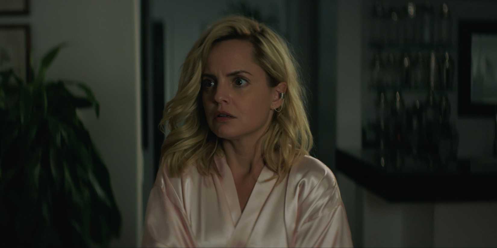 Mena Suvari as Nicole Brown Simpson looking scared in her home in 'The Murder of Nicole Brown Simpson' (2019)