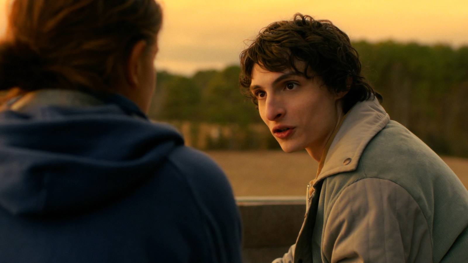 Mike Wheeler looking concerned while talking to Eleven on the rooftop in Stranger Things Season 5 Volume 1