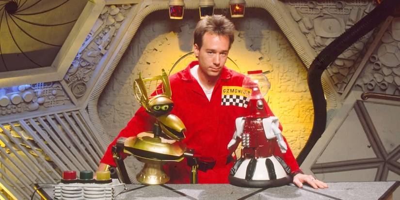 Joel standing on the bridge with Crow T. Robot and Tom Servo in Mystery Science Theater 3000