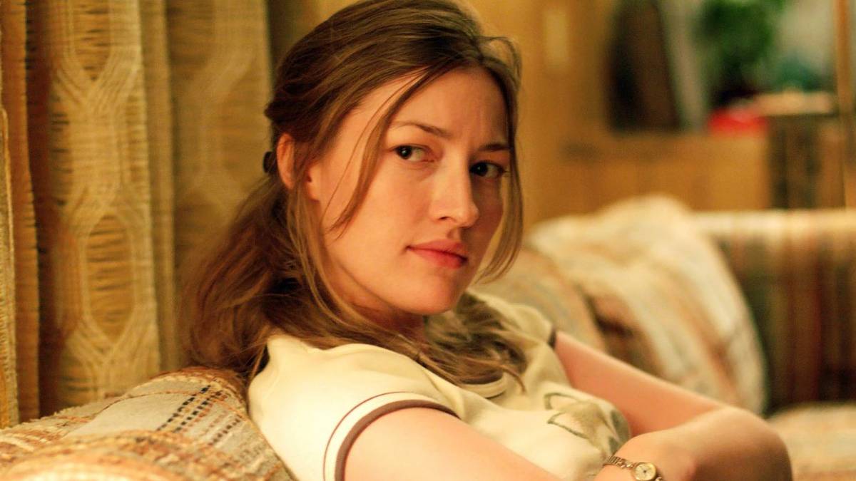 Carla Jean looking suspicious with her arms crossed