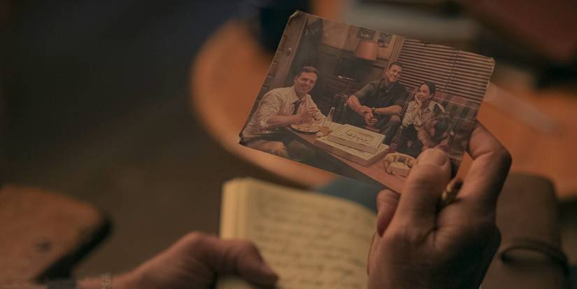 Older Gibbs holding a picture of himself in the past in NCIS: Origins