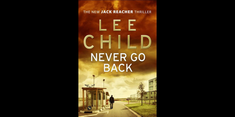 A man walks by a deserted city on the book cover for Never Go Back by Lee Child.