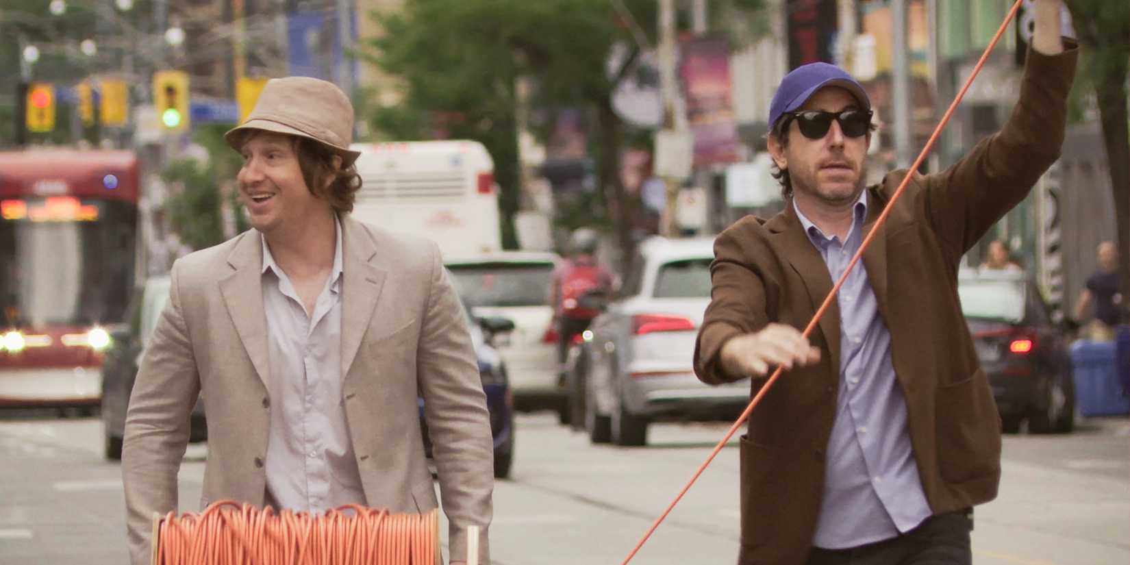 Two men walking down the street in Nirvanna-the-Band-the-Show