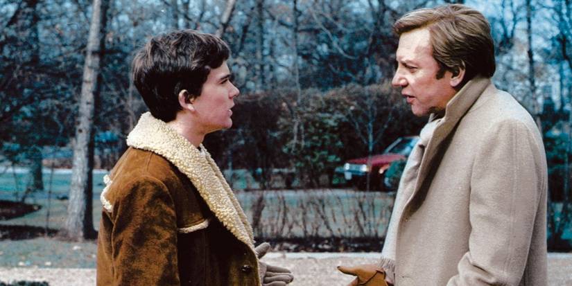 Donald Sutherland and Timothy Hutton having a serious talk outside in cold weather in Ordinary People. 