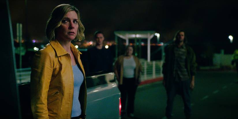 Rhea Seehorn looking warily at people in Pluribus Episode 1
