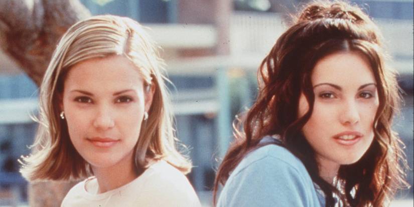 Leslie Bibb and Carly Pope posing back to back for the show Popular