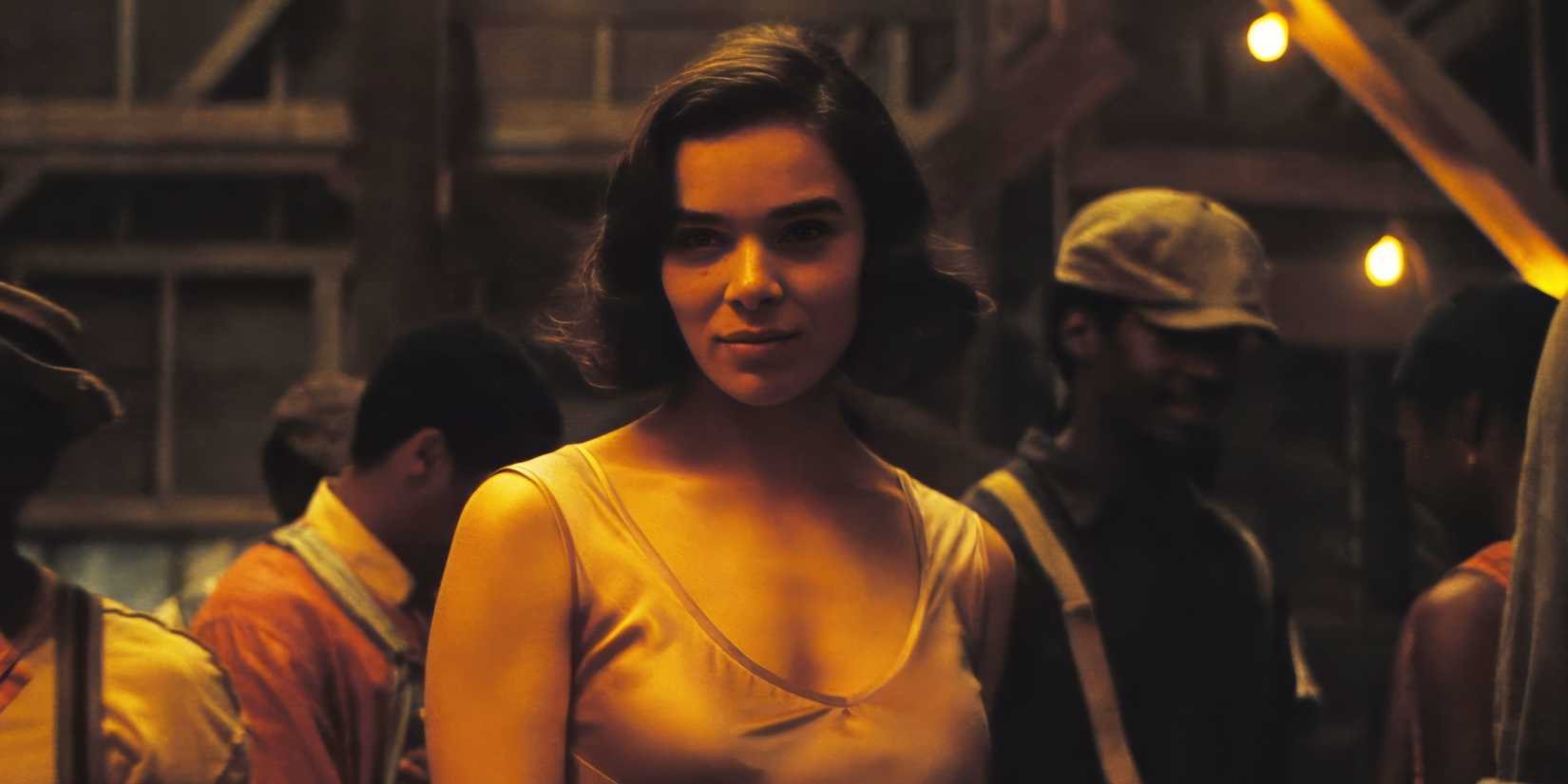 Sinners' Hailee Steinfeld stands at a barn party, smiling seductively