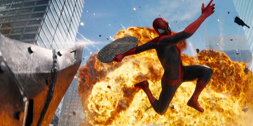 Spider-Man swinging a sewer cover at Rhino in The Amazing Spider-Man 2