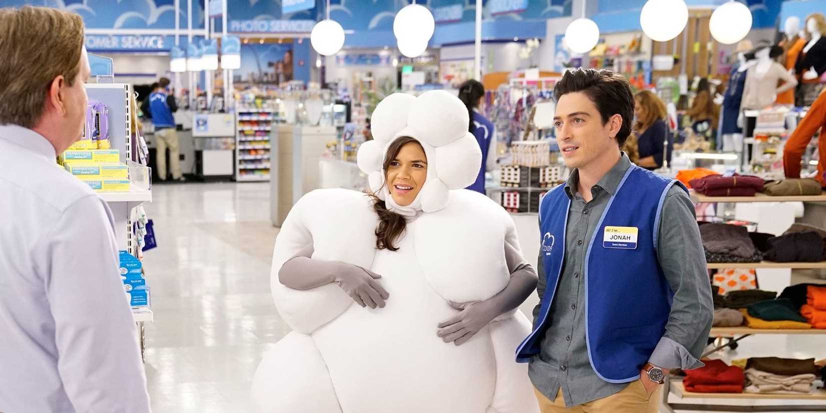 Amy in a cloud costume standing next to Jonah in the Spokesman Scandal episode of Superstore.