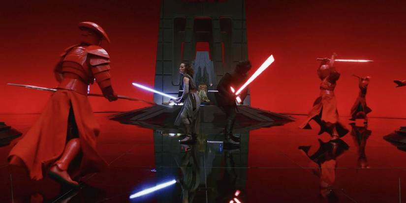 Rey and Kylo Ren fighting red guards in Star Wars: The Last Jedi