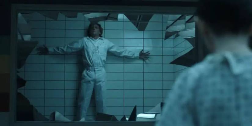 Henry/Vecna pinned against a wall in Stranger Things.