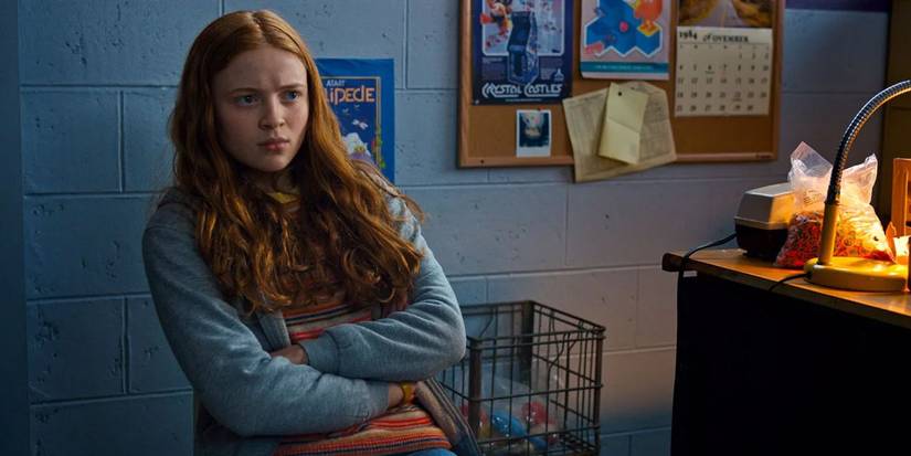 Max (Sadie Sink) sitting in an office in 'Stranger Things' Season 2.