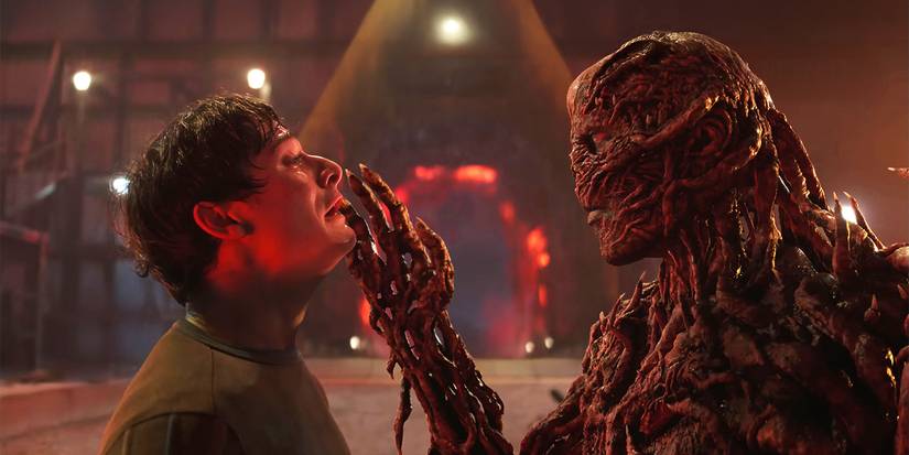 Vecna touching a scared Will's face in Stranger Things.
