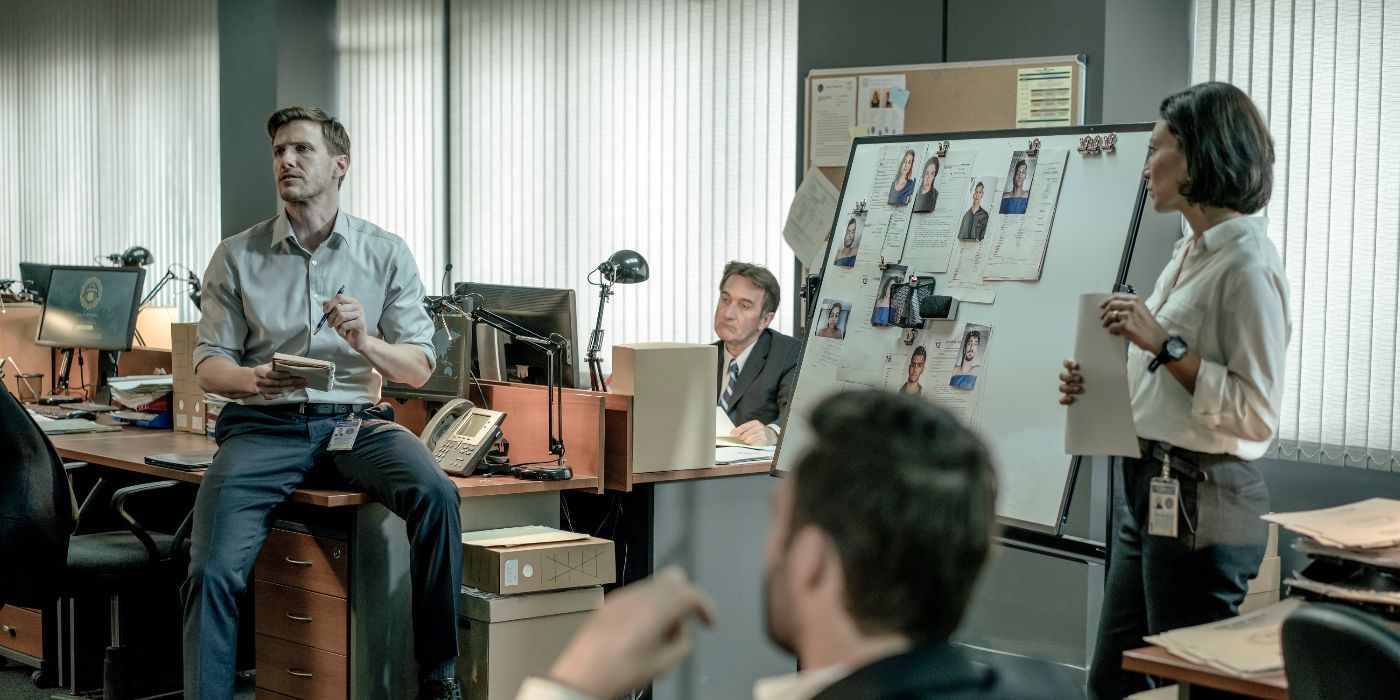 Patrick Heusinger is having a meeting with fellow FBI agents in Absentia.