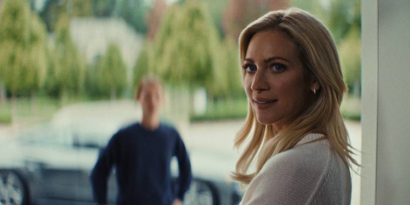 Brittany Snow as Nina Jarvis stands in the doorway in 'The Beast in Me.'