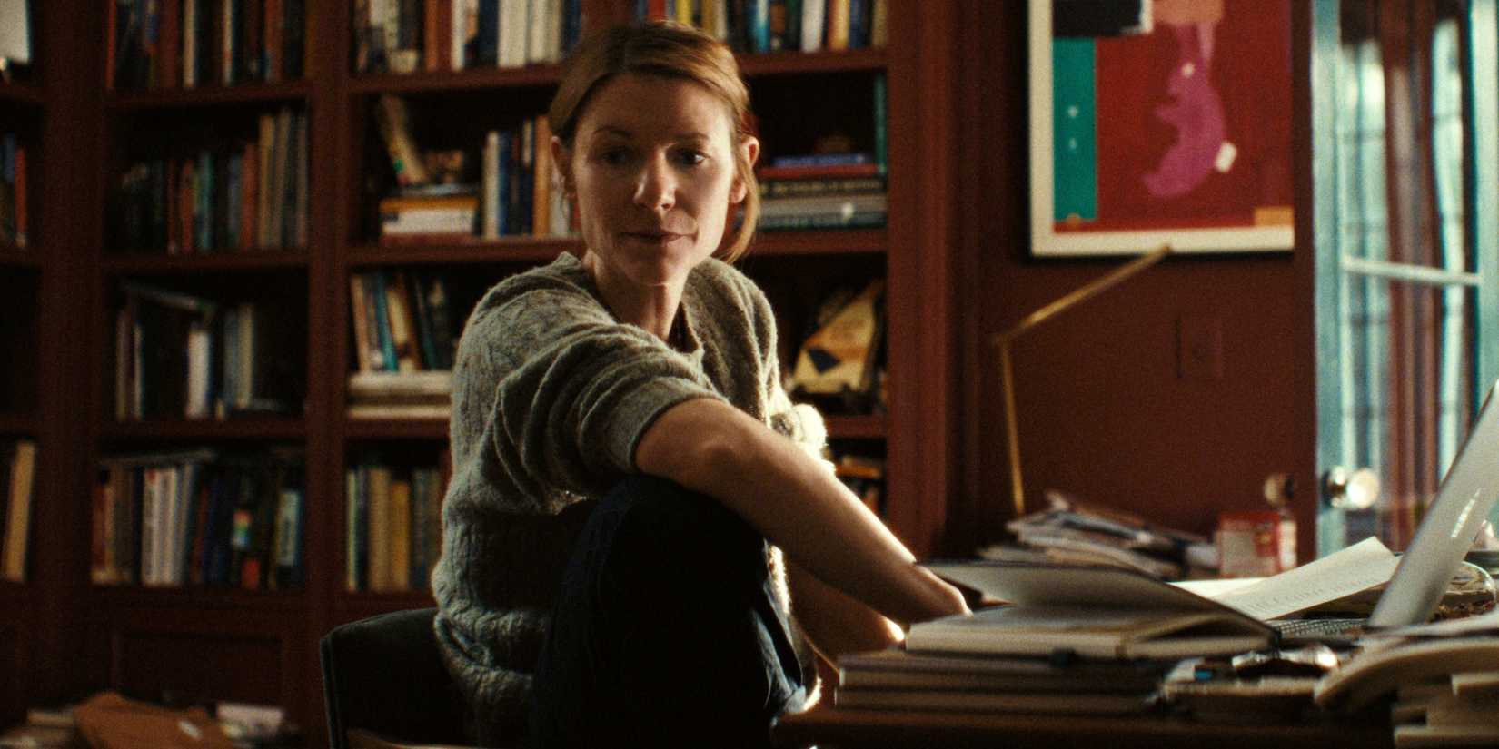 Claire Danes as Aggie sitting at the desk in her office at home in The Beast in Me