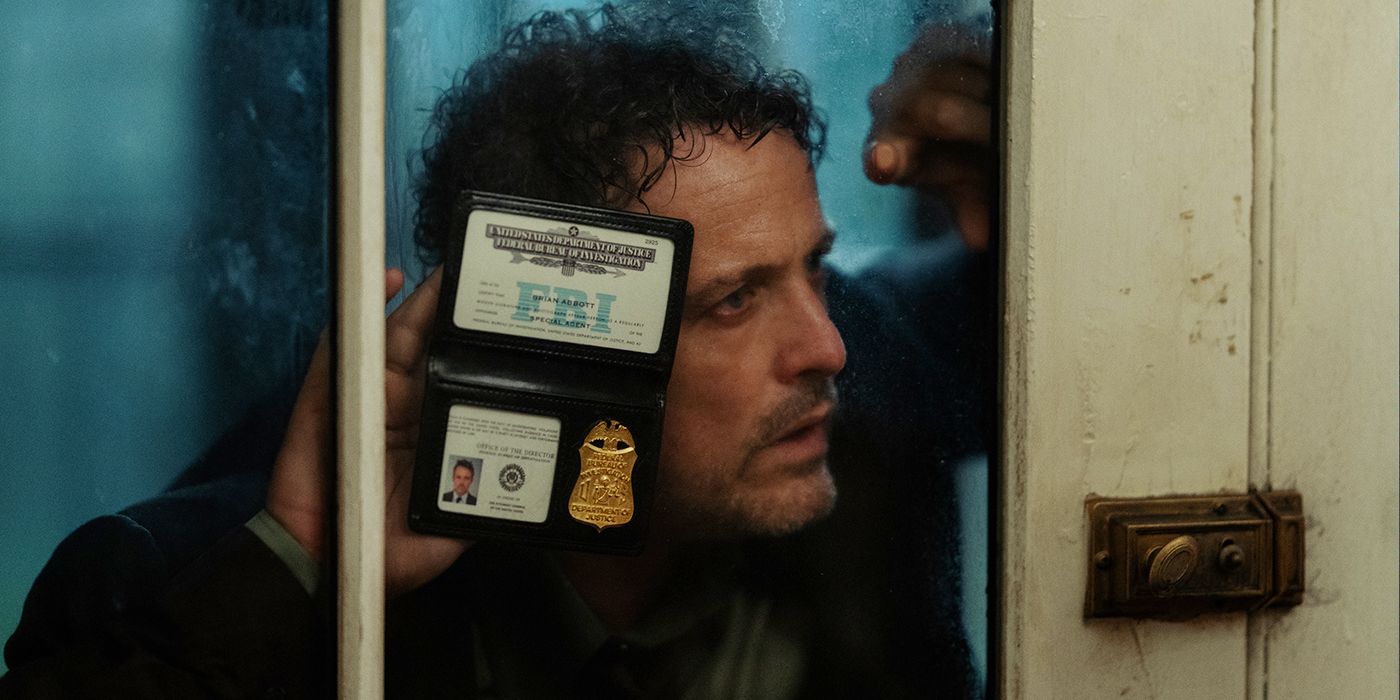 David Lyons holding up an FBI badge in The Beast in Me