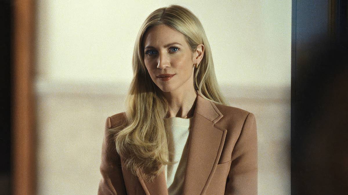 Brittany Snow in a tan blazer staring ahead in The Beast in Me.