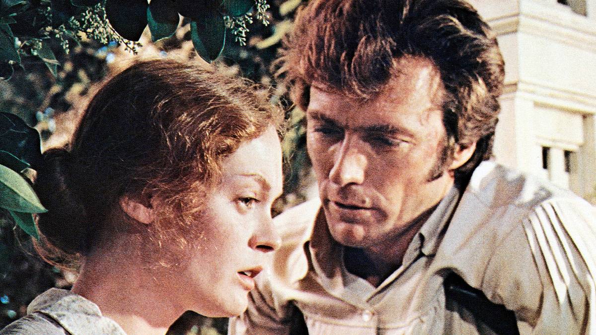 Man looking down on a woman