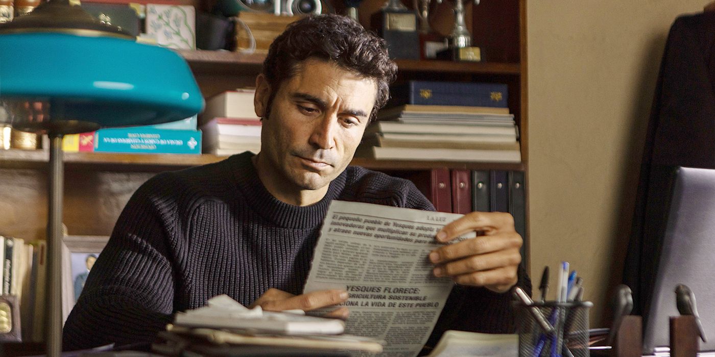Miguel reading a news clipping