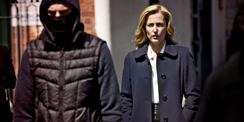 Gillian Anderson follows a suspicious man wearing a balaclava in The Fall.