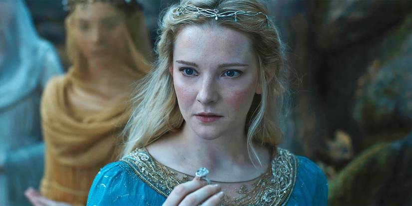 Morfydd Clark as Galadriel holding a ring and looking alarmed in The Lord of-the Rings-The Rings of Power.