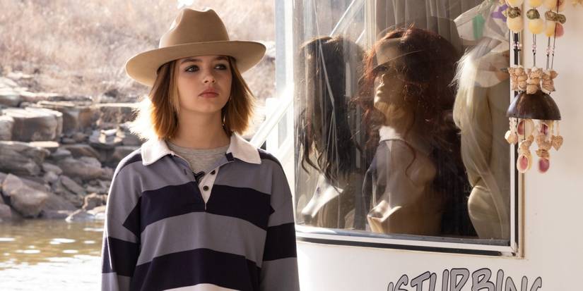 Ryan Kiera Armstrong as Francis standing outside in a hat in The Lowdown