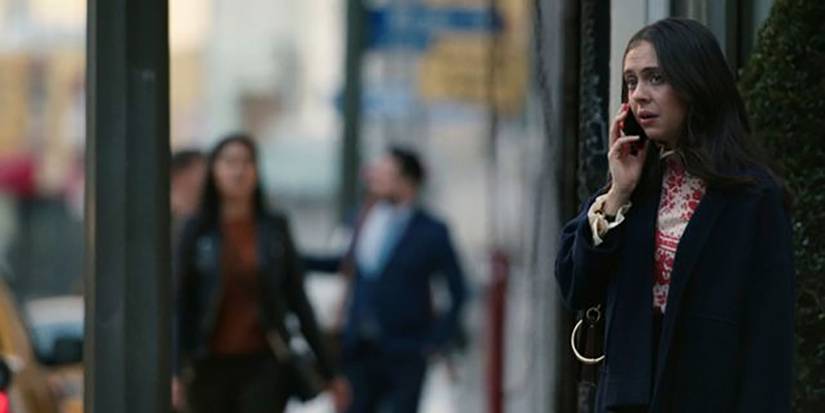 Claire on the street on the phone in The Morning Show.