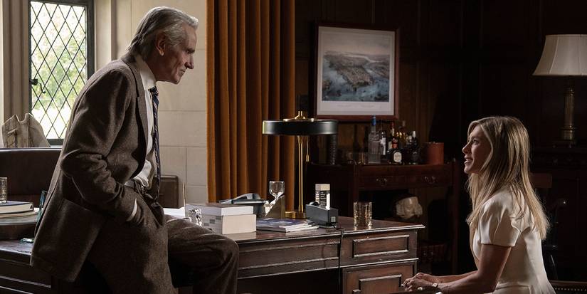 Martin with his hand in his pocket talking to Alex who is sitting in The Morning Show.