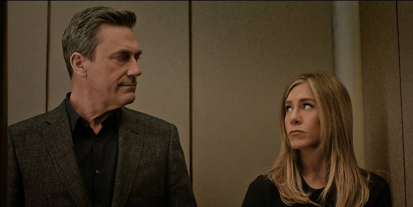 Paul and Alex looking at one another in an elevator in The Morning Show.