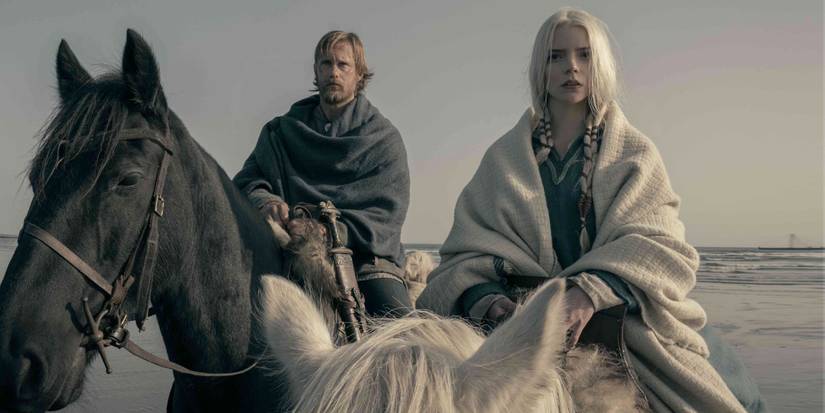 Alexander Skarsgård and Anya Taylor-Joy on horseback near the ocean in a scene from The Northman (2022)