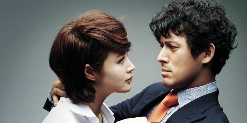 Kim Hye-soo and Oh Ji-ho hugging and staring at each other in The Queen of Office