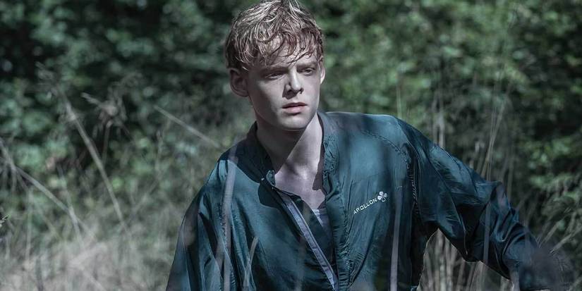 Lucas Lynggaard Tønnesen walks in the woods in The Rain