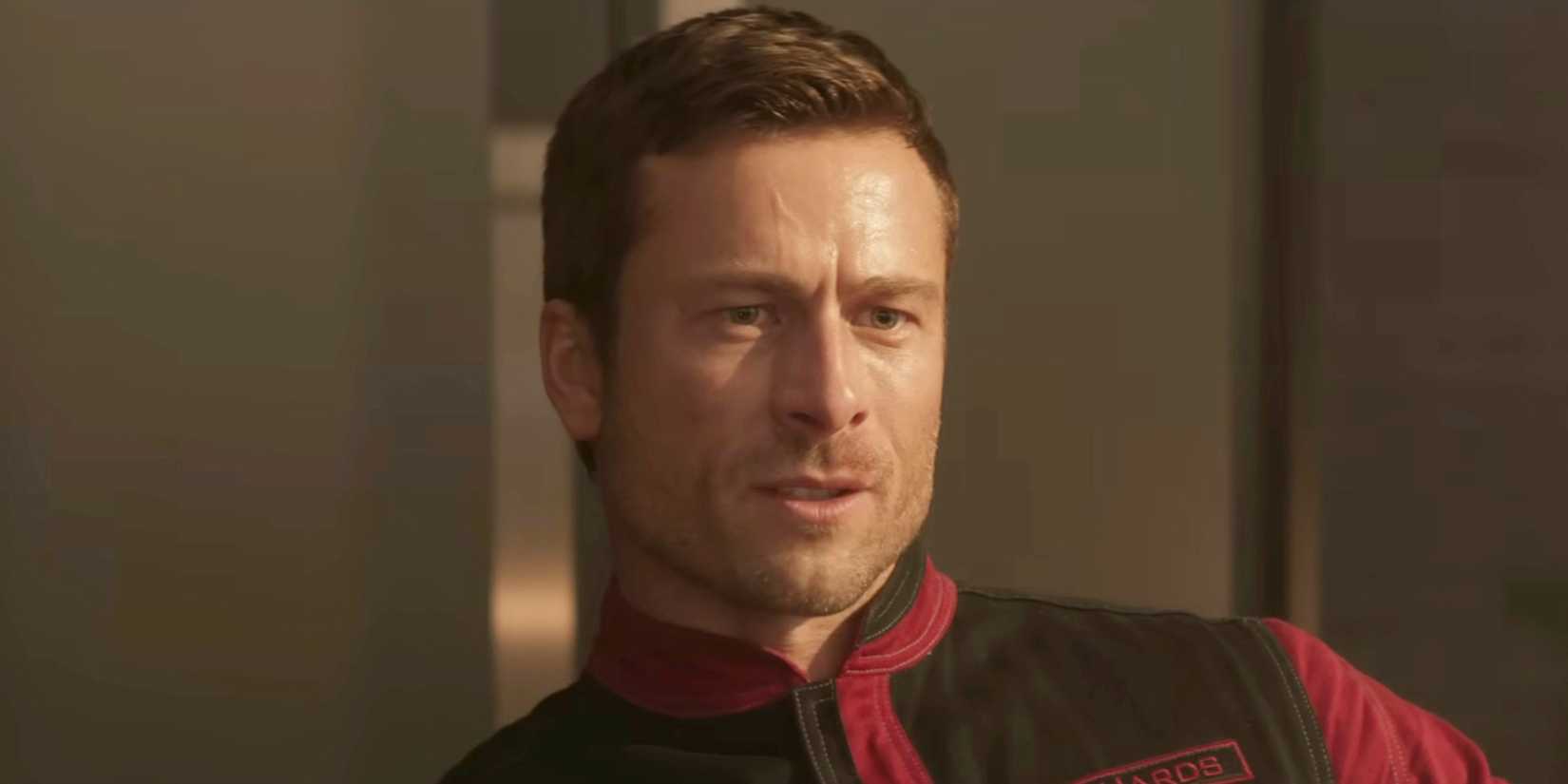 Glen Powell as Ben Richards frowning slightly in The Running Man