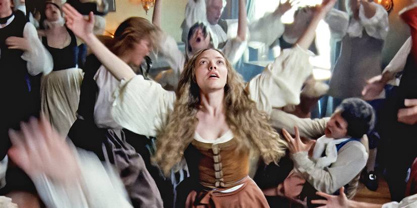 Amanda Seyfried as Ann Lee dancing with people around her in 'The Testament of Ann Lee'