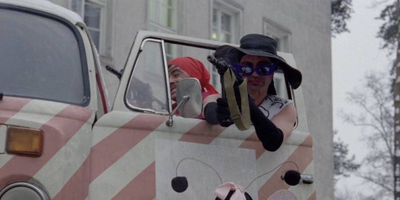 Udo Kier looking out of an open car window in The Third Generation