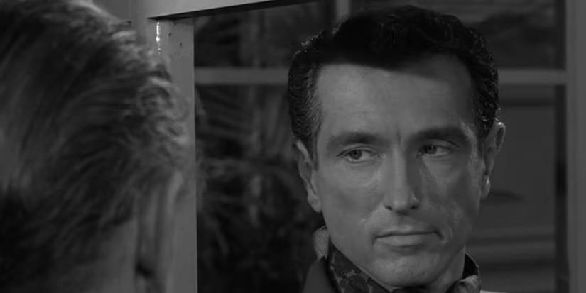 A man looks sternly at an older man in The Twilight Zone episode The Silence. 