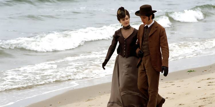 Paul and Mrs. Hurtle walking arm-in-arm on the beach in The Way We Live Now