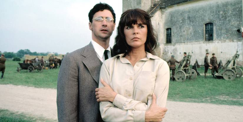 David Dukes and Ali Macgraw standing together in The Winds of War