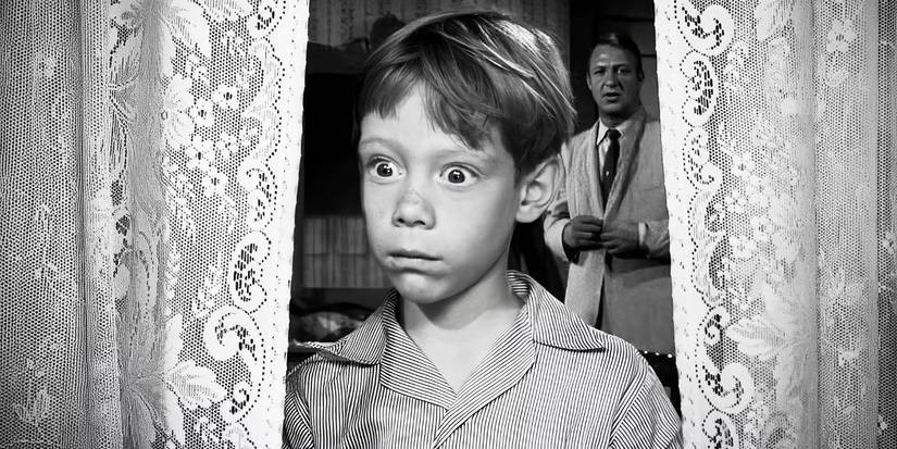 Anthony Fremont (Billy Mumy) looking out the window in 'The Twilight Zone's "It's A Good Life"