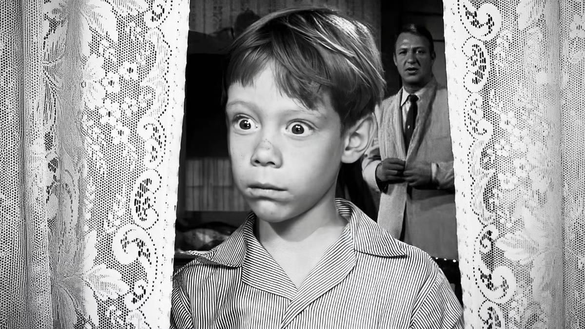Anthony Fremont (Billy Mumy) looking out the window in 'The Twilight Zone's 