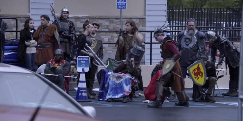Customers dressed in renaissance garb outside the store in Superstore episode Video Game Release.