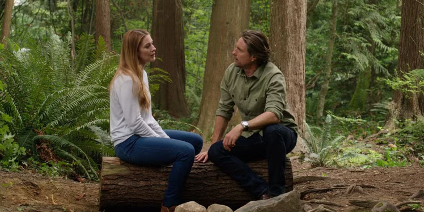 Alexandra Breckenridge as Mel and Martin Henderson as Jack in the woods on 'Virgin River.'