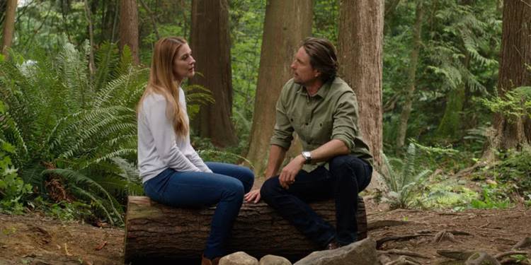 Alexandra Breckenridge as Mel and Martin Henderson as Jack in the woods on 'Virgin River.'