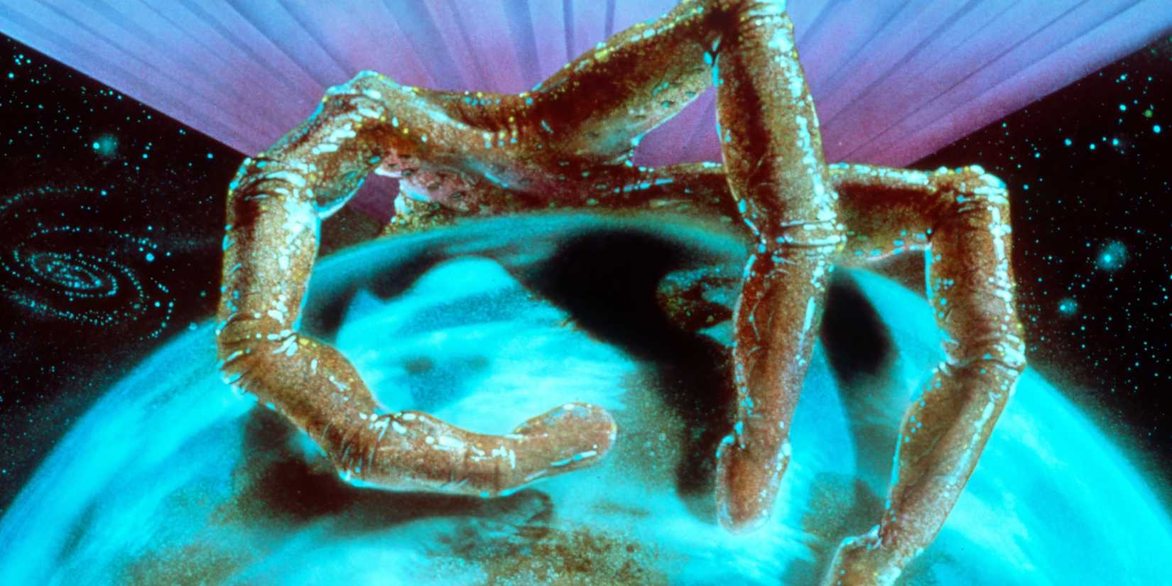 A creepy alien grabbing the Earth in War of the Worlds 