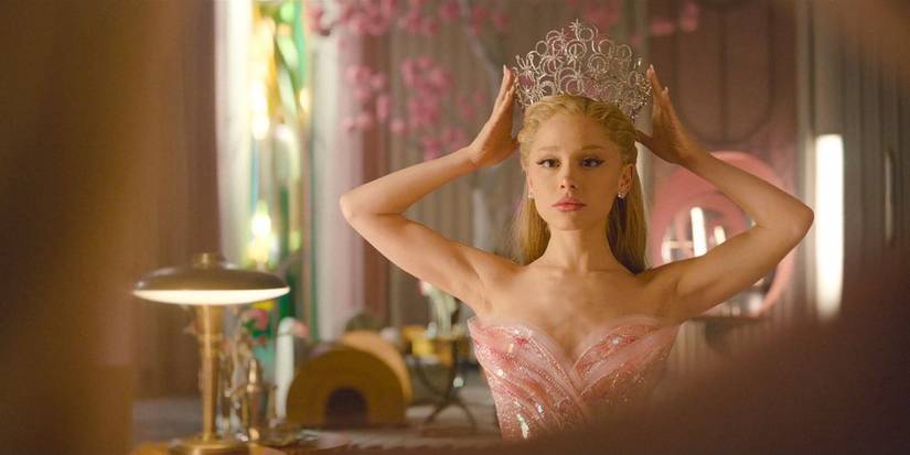 Glinda (Ariana Grande) putting her crown on her head in 'Wicked: For Good'