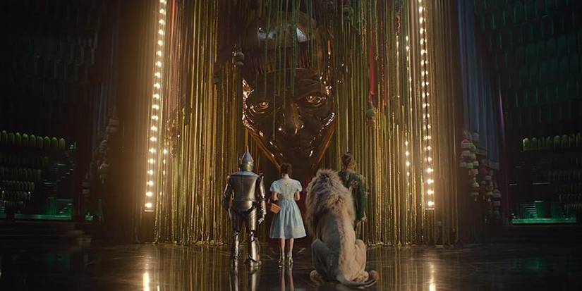 The Tin Man, Dorothy, the Cowardly Lion, and the Scarecrow face the Wizard in 'Wicked: For Good.'