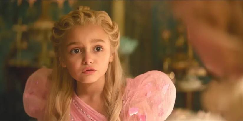 Scarlett Spears as Young Glinda talking to someone off-camera in 'Wicked: For Good.'