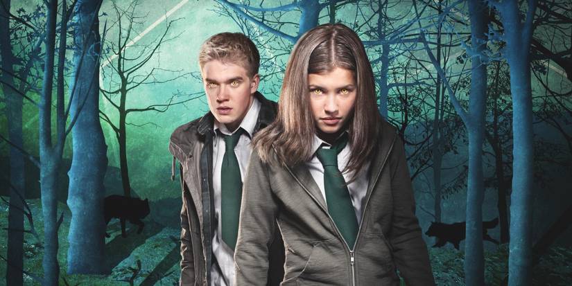 Rhydian standing behind Maddy as they both stare ahead with yellow eyes in Wolfblood