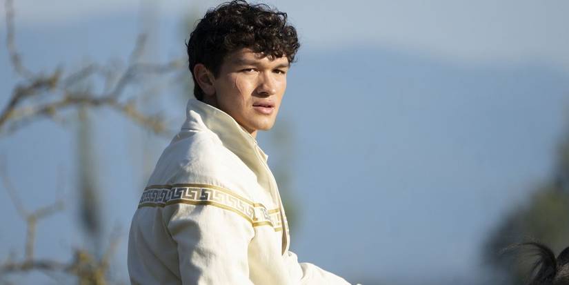 Luke looking to the side while outdoors in Season 2 of 'Percy Jackson and the Olympians.'
